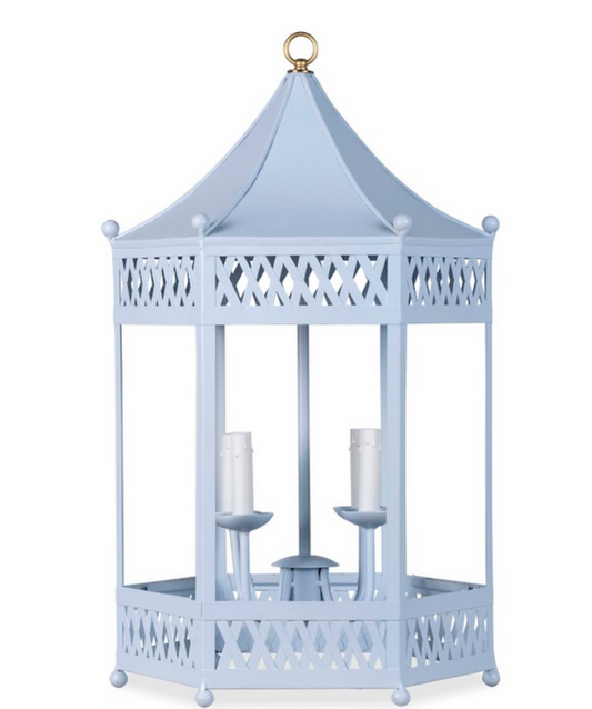 a light blue lantern with candles