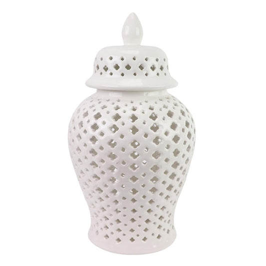a white vase with holes