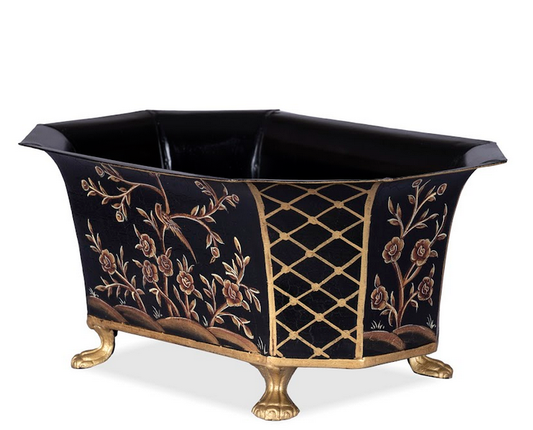 a black and gold tub with gold legs