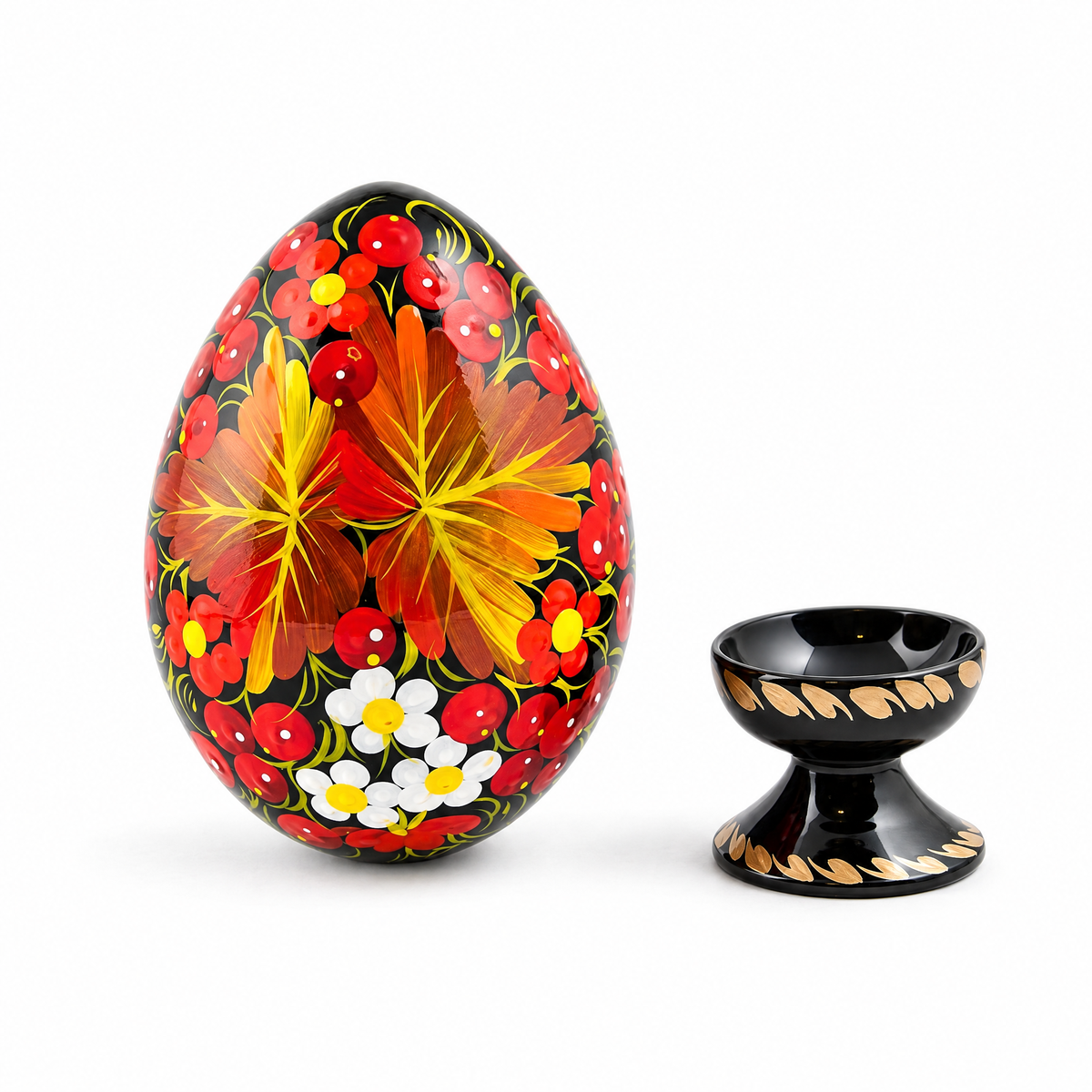 a painted egg with a small cup