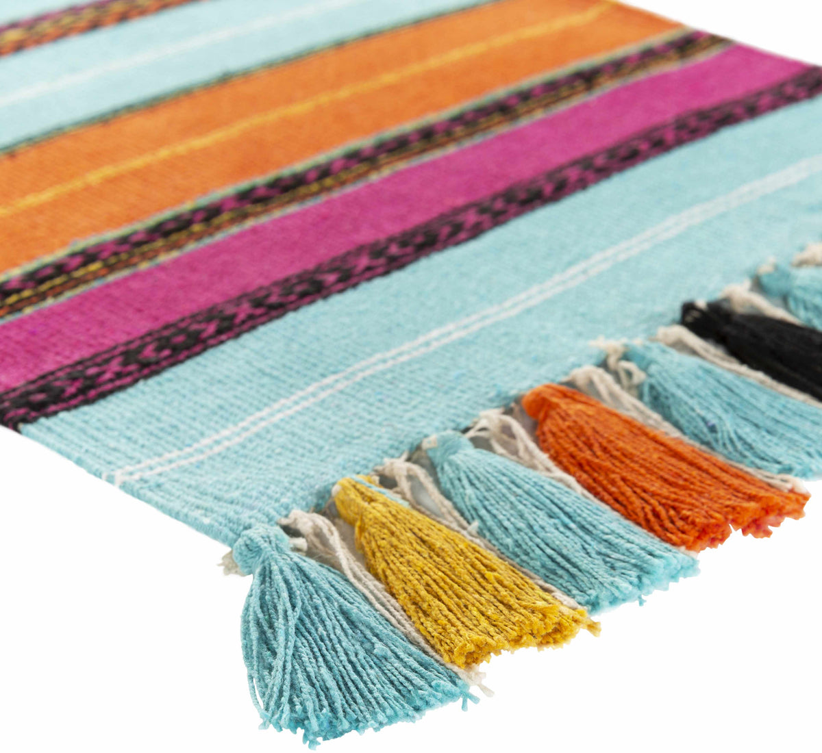 a colorful rug with tassels