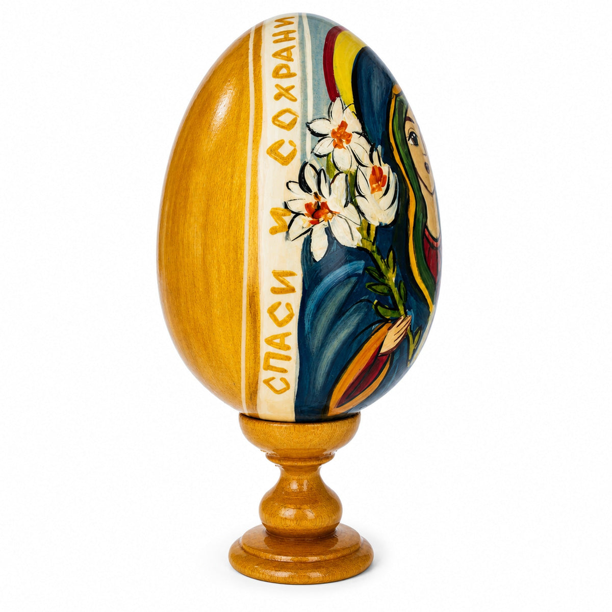 a painted egg on a stand