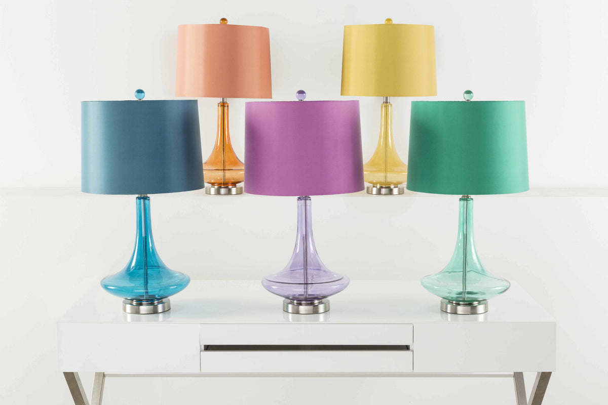 a group of colorful lamps on a white surface