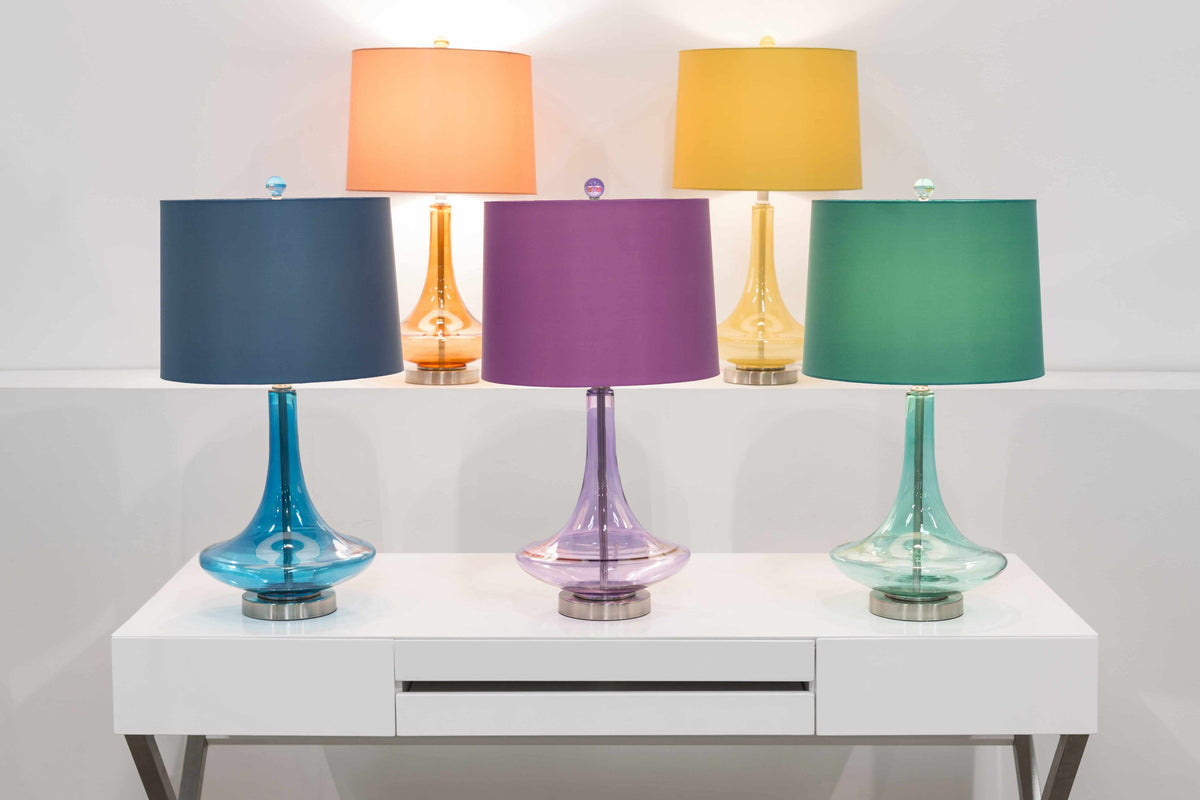 a group of colorful lamps on a white table